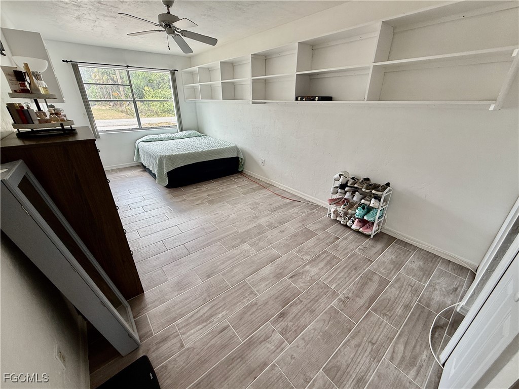 314 Vermont Way Lehigh Acres, FL 33936 - Photo 19 of 45 a living room with furniture and a flat screen tv