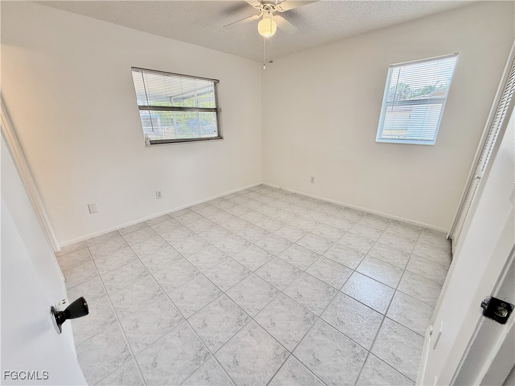 314 Vermont Way Lehigh Acres, FL 33936 - Photo 22 of 45 an empty room with a window