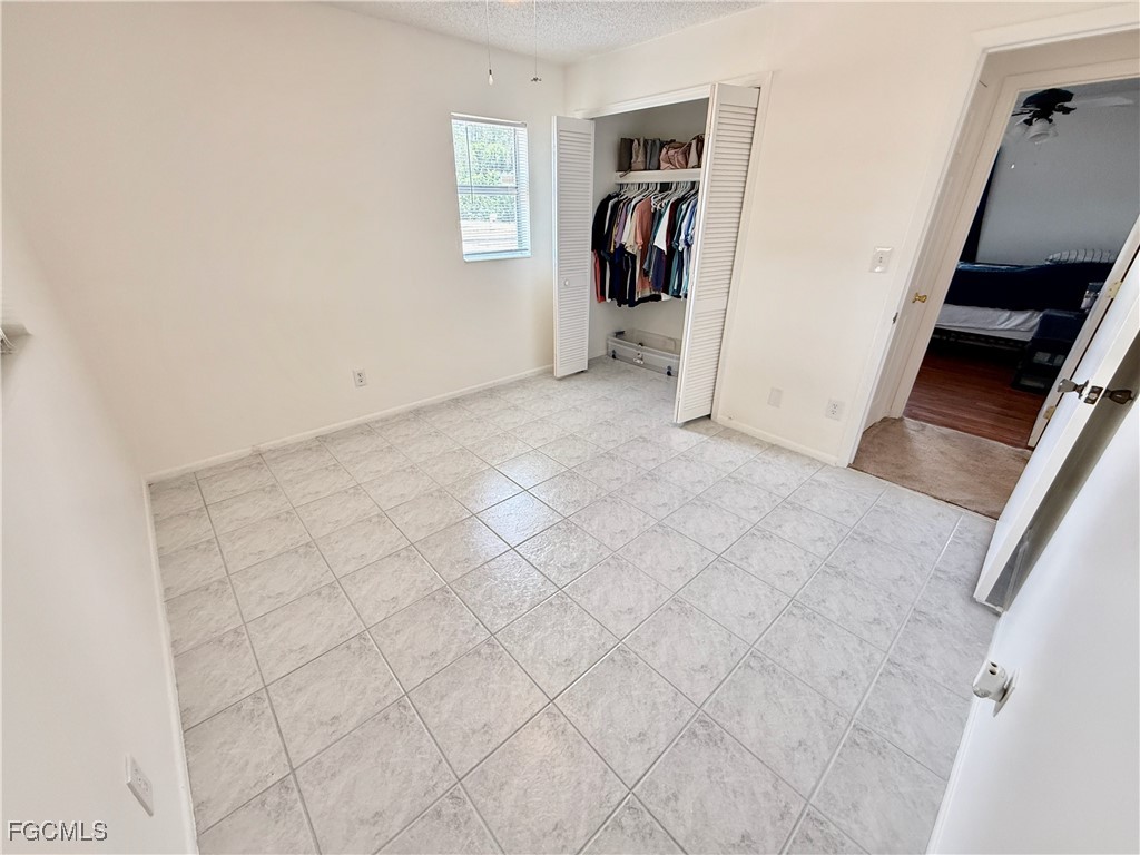 314 Vermont Way Lehigh Acres, FL 33936 - Photo 23 of 45 a view of a livingroom with walk in closet and a window