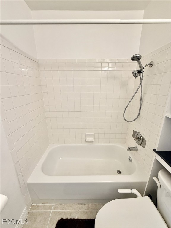 314 Vermont Way Lehigh Acres, FL 33936 - Photo 32 of 45 a bathroom with a bathtub and a shower