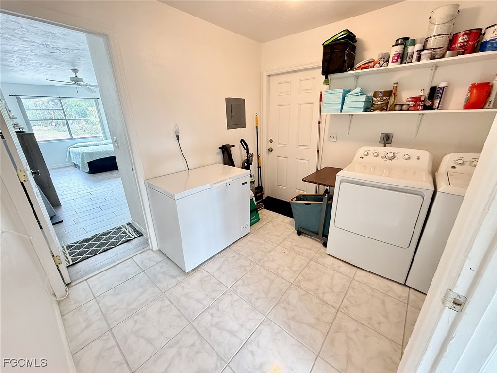 314 Vermont Way Lehigh Acres, FL 33936 - Photo 35 of 45 a living room with furniture and a table