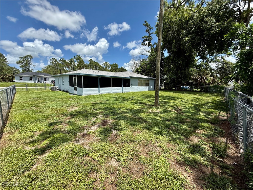 314 Vermont Way Lehigh Acres, FL 33936 - Photo 43 of 45 a backyard of a house with lots of green space