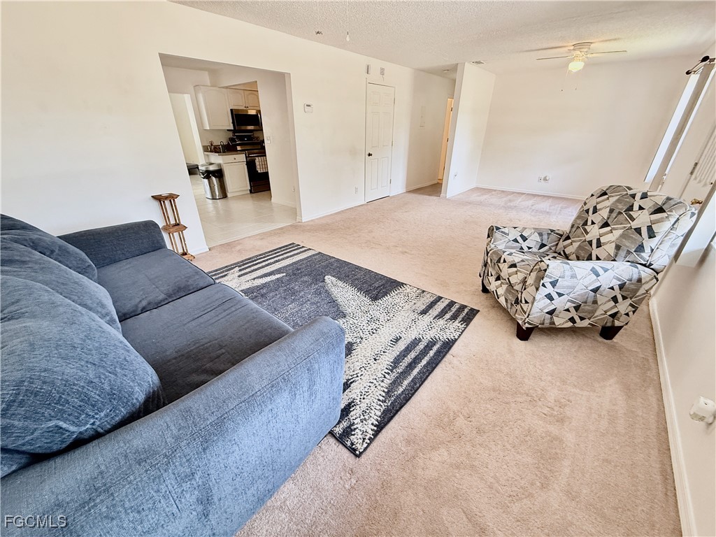 314 Vermont Way Lehigh Acres, FL 33936 - Photo 7 of 45 a living room with furniture and a couch