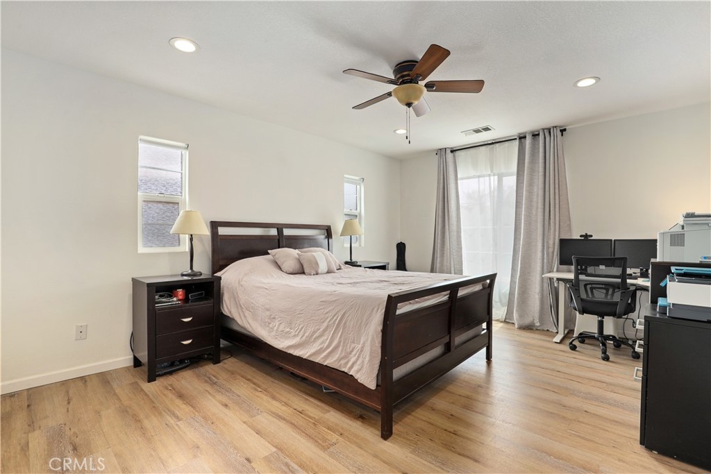 28364 Mirabelle Lane Saugus, CA 91350 - Photo 12 of 32 a bedroom with a bed and wooden floor