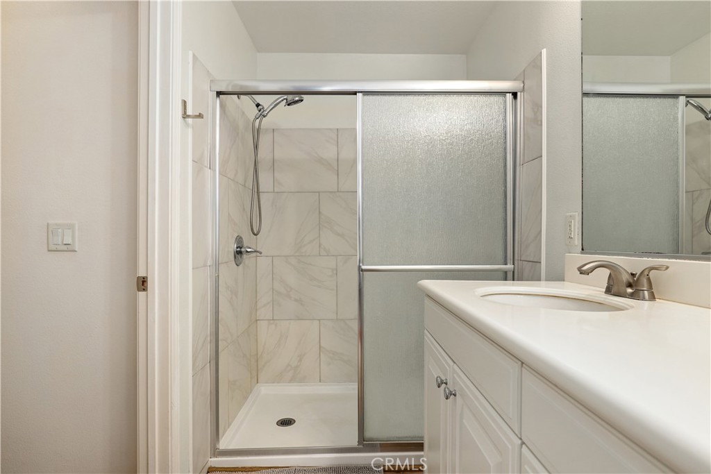 28364 Mirabelle Lane Saugus, CA 91350 - Photo 15 of 32 a bathroom with a shower sink and mirror