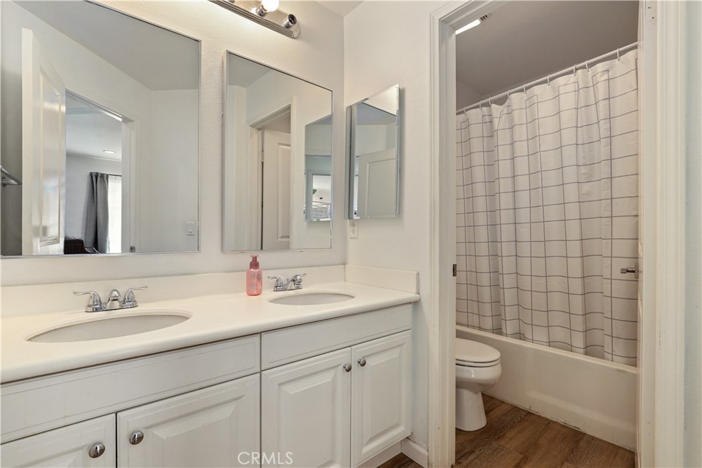 28364 Mirabelle Lane Saugus, CA 91350 - Photo 18 of 32 a bathroom with a sink a toilet and shower
