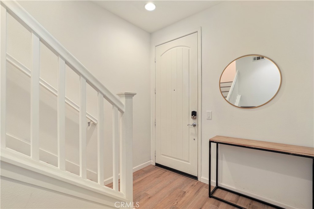 28364 Mirabelle Lane Saugus, CA 91350 - Photo 2 of 32 an entryway view with wooden floor and staircase