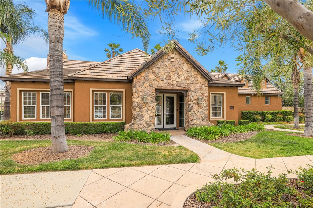 28364 Mirabelle Lane Saugus, CA 91350 - Photo 24 of 32 a front view of a house with a yard and potted plants