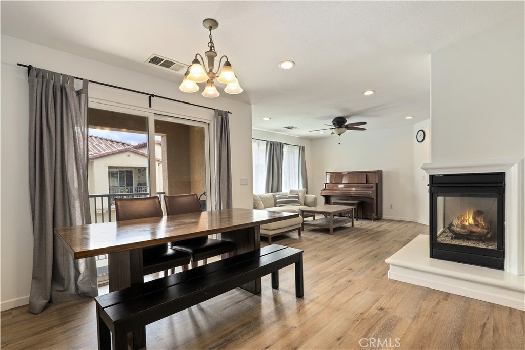 28364 Mirabelle Lane Saugus, CA 91350 - Photo 3 of 32 a living room with furniture a fireplace and wooden floor