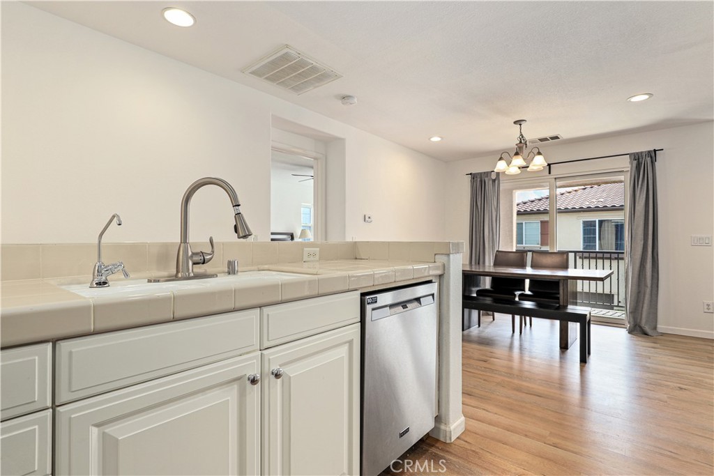 28364 Mirabelle Lane Saugus, CA 91350 - Photo 5 of 32 a kitchen with counter top space and wooden floor