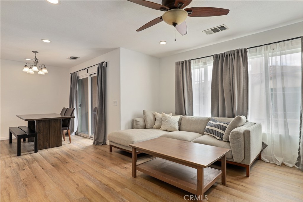 28364 Mirabelle Lane Saugus, CA 91350 - Photo 10 of 32 a living room with furniture and a chandelier