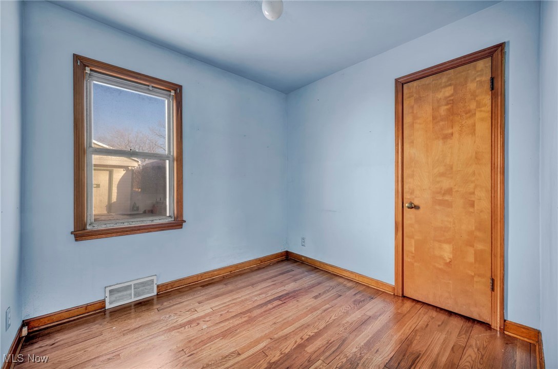14750 Schreiber Road Maple Heights, OH 44137 - Photo 23 of 44 Spare room with light wood-style flooring and baseboards