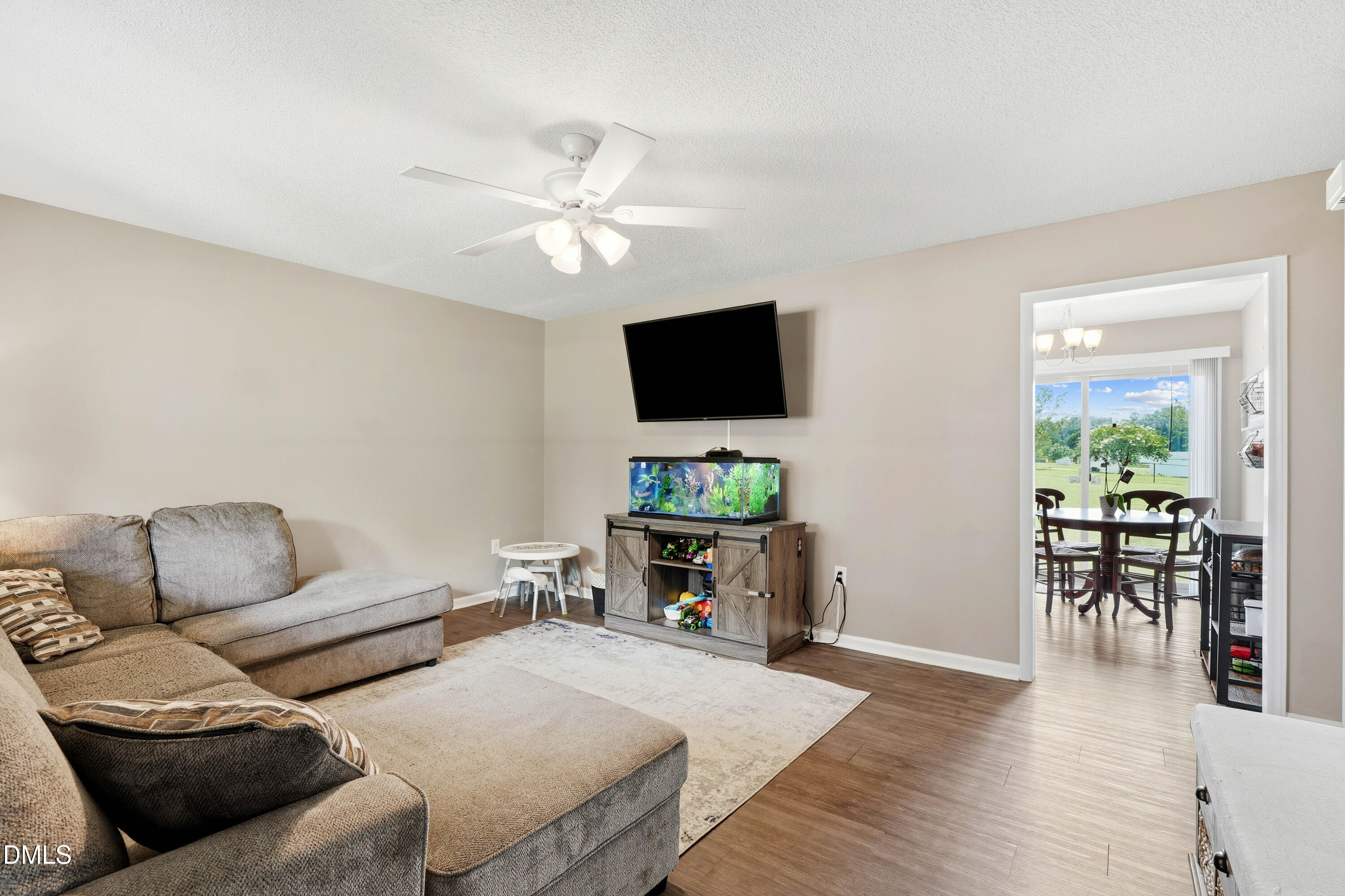 101 Stephenson Road Benson, NC 27504 - Photo 8 of 29 a living room with furniture and a flat screen tv