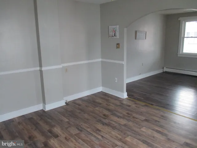 a kitchen with a sink stove and microwave