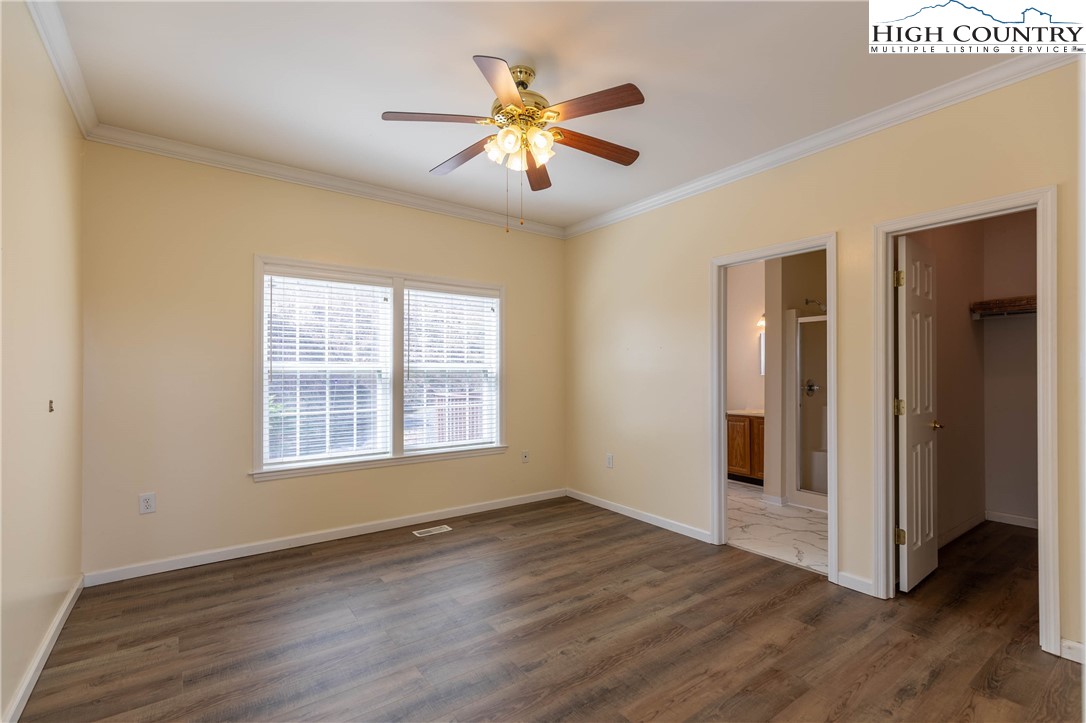 449 Meadow Ridge Drive Jefferson, NC 28640 - Photo 17 of 37 a view of an empty room with wooden floor and a window