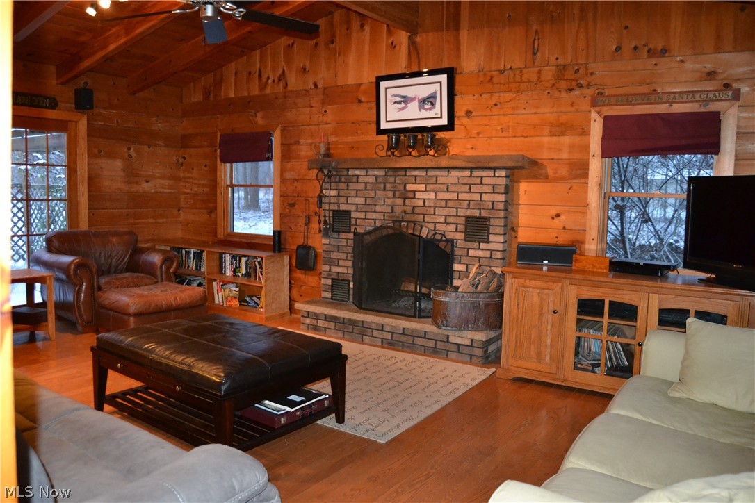4864 Phillips Rice Road Cortland, OH 44410 - Photo 35 of 35 The cathedral ceiling in the family room makes the floor plan feel extra spacious and the brick fire place adds warmth.