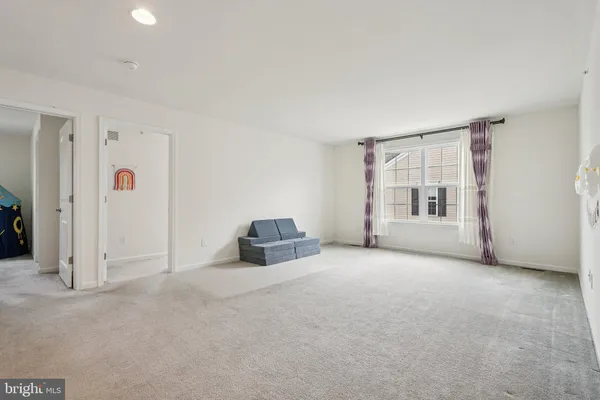 a view of empty room with windows