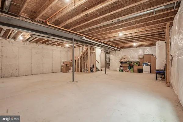 a view of empty room with wooden ceiling