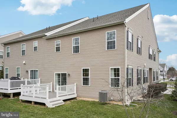 a view of house with backyard