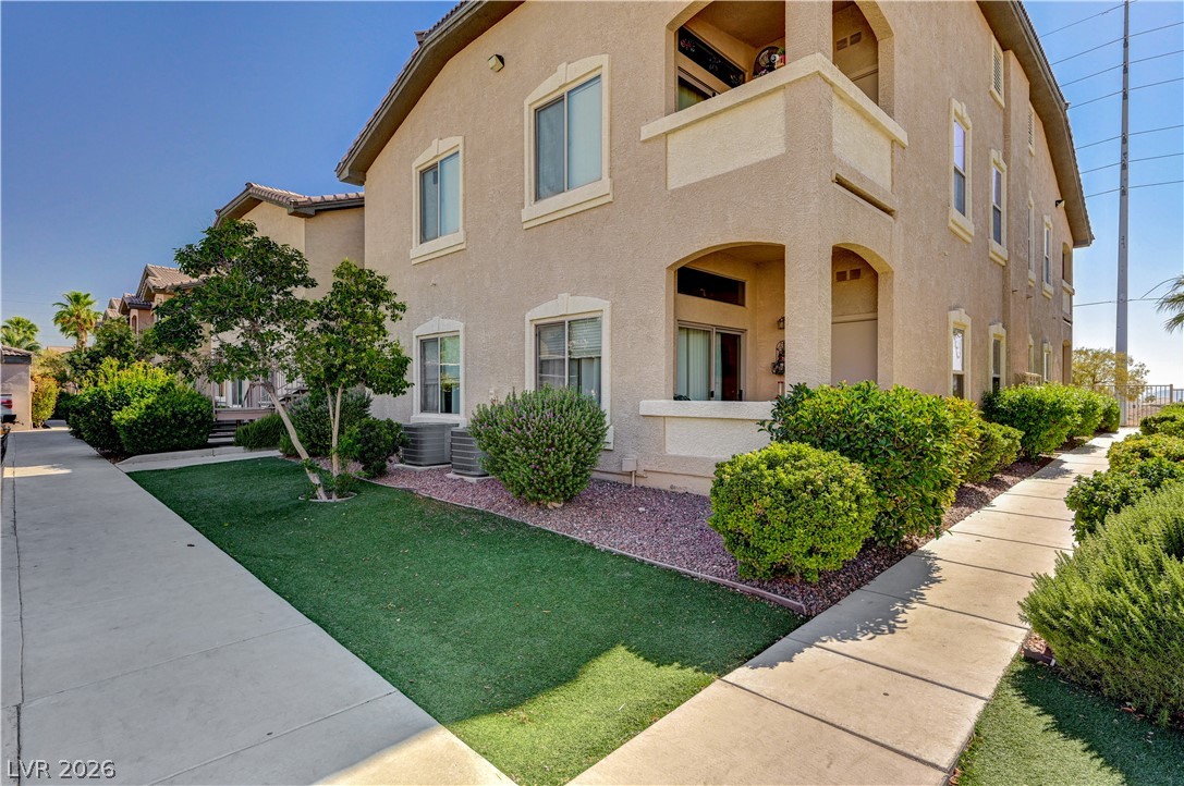 8985 South Durango Drive, Unit 2187 Las Vegas, NV 89113 - Photo 7 of 73 Clean lines and inviting landscaping frame this appealing multi-story residence.