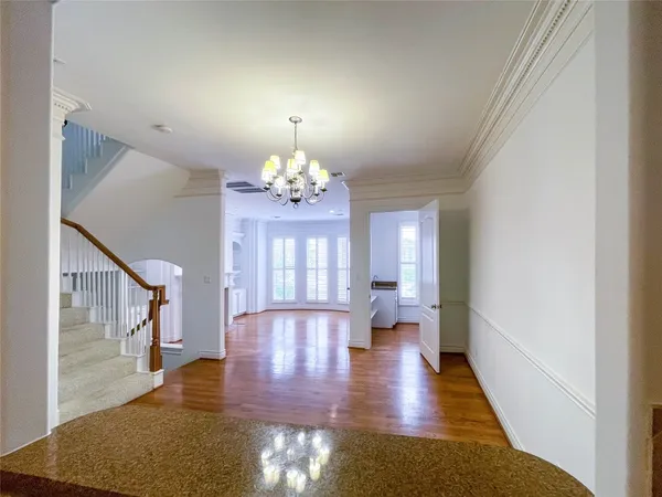 a living room with furniture and next to a large window