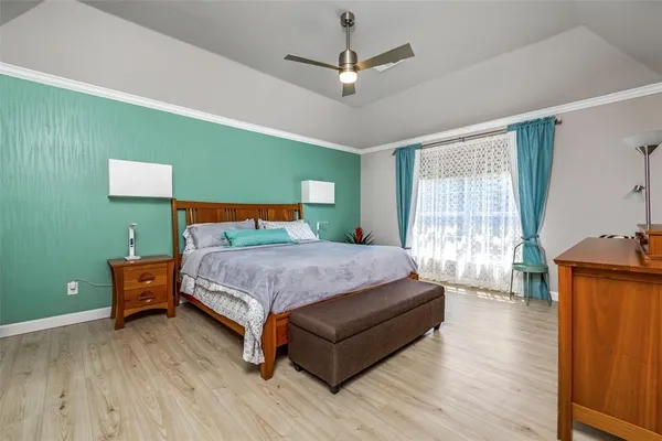 a bedroom with a bed and window