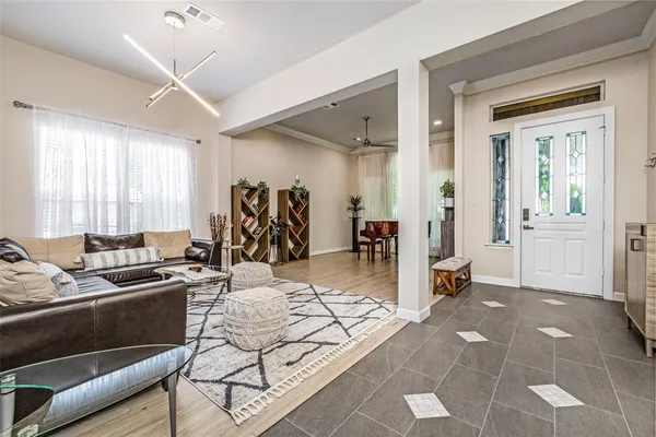 a view of a livingroom with furniture and windows