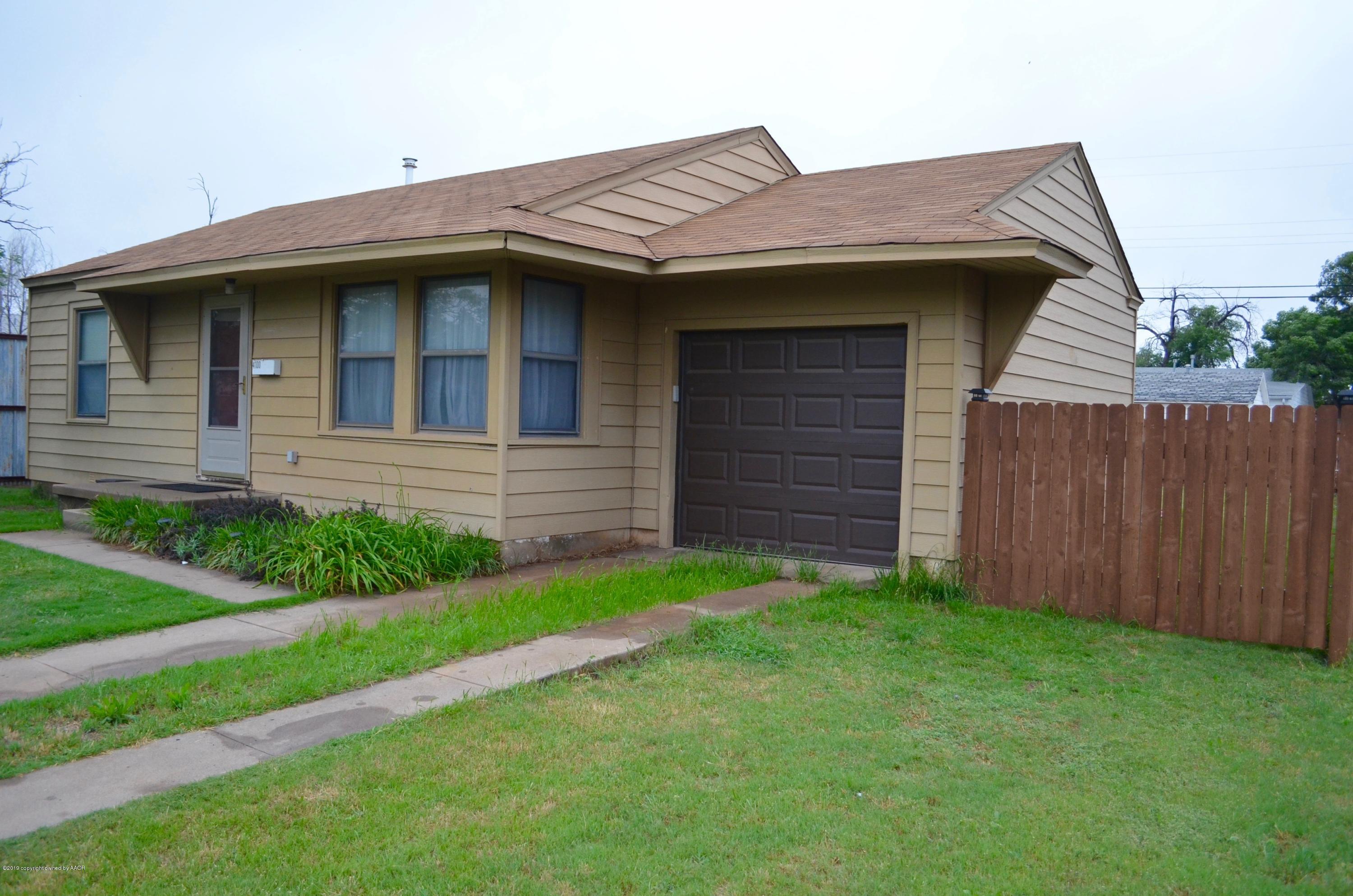 4100 Cline Road Amarillo, TX 79110 - Photo 2 of 10 a view of a house with a small yard and a large window