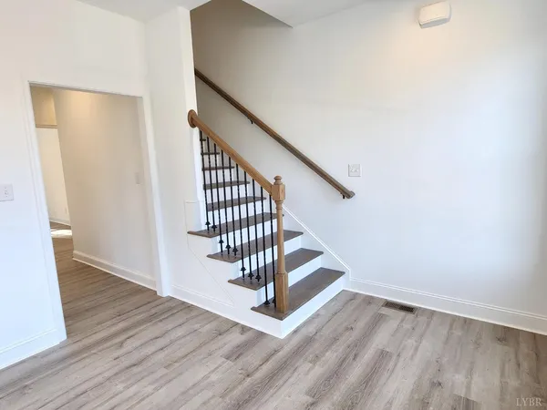 a view of entryway with wooden floor