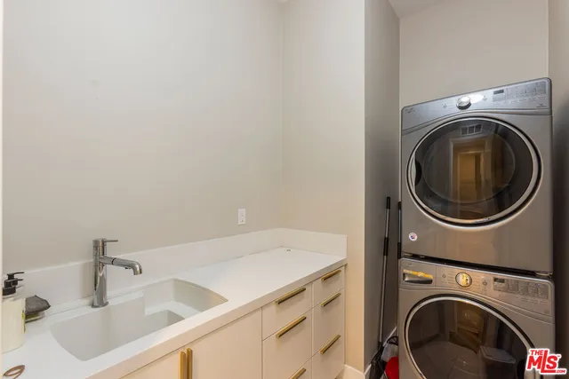 a bedroom with a bed and a flat screen television