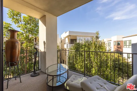 a spacious bathroom with a granite countertop sink and a mirror