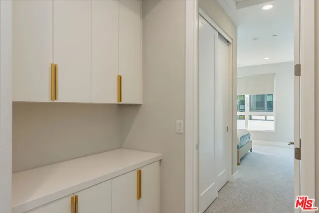 a bedroom with a large bed and a large window