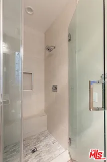 a view of a two chair in the patio and a yard