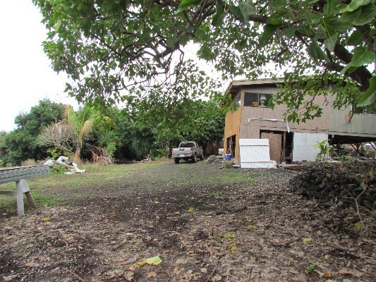 88-2512 Milolii Road Captain Cook, HI 96704 - Photo 13 of 24 a front view of a house with a yard and garage