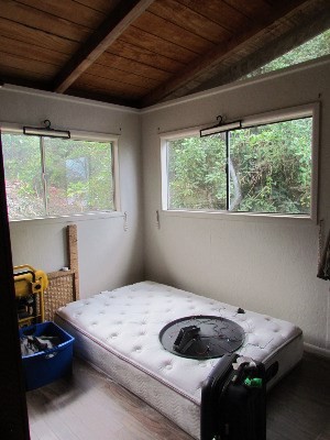 88-2512 Milolii Road Captain Cook, HI 96704 - Photo 9 of 24 a bedroom with a bed and a window