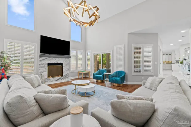 a kitchen with stainless steel appliances kitchen island granite countertop a refrigerator and a stove top oven