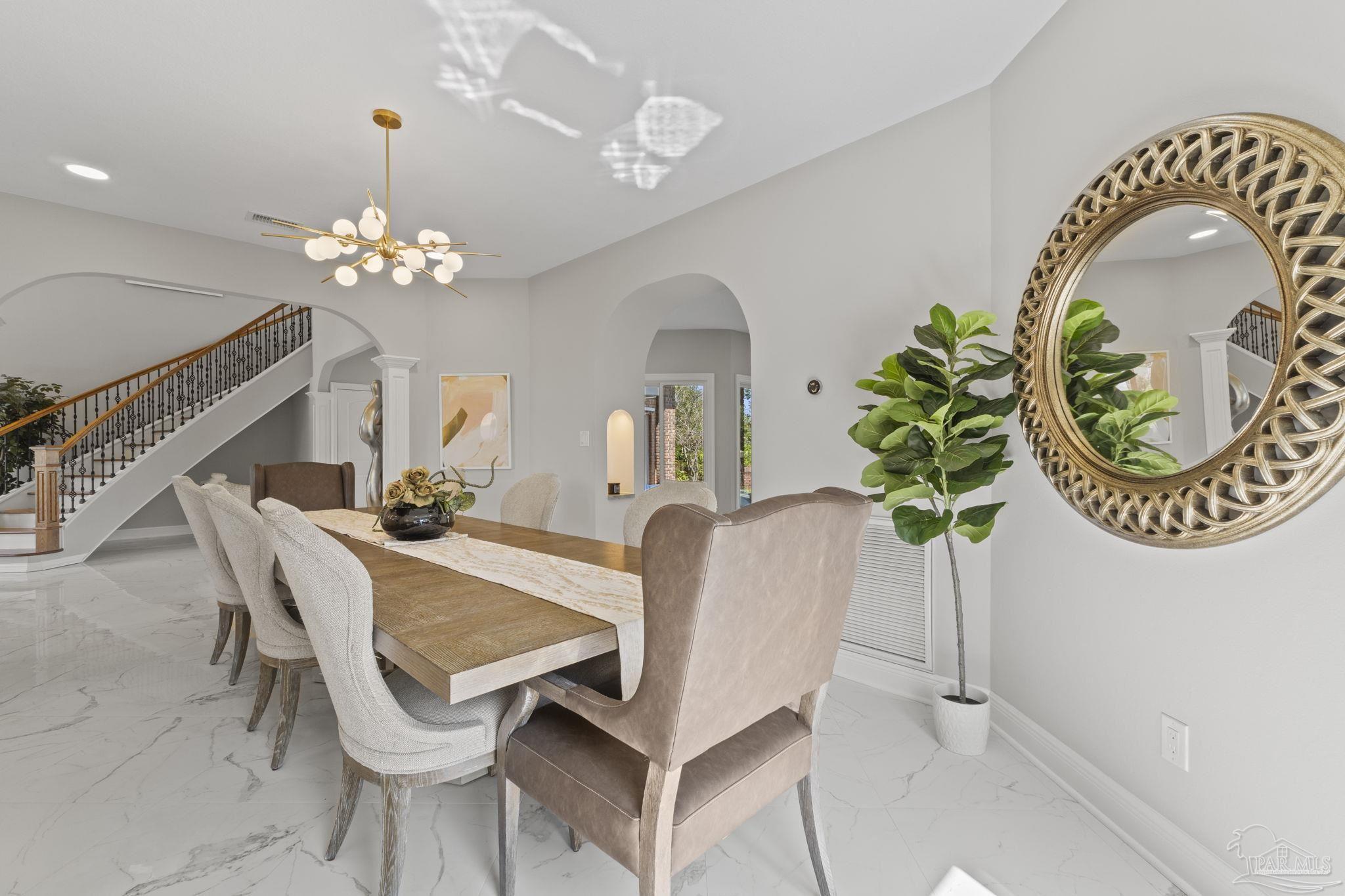 4818 Rosemont Place Pensacola, FL 32514 - Photo 18 of 69 a view of a dining room with furniture and chandelier