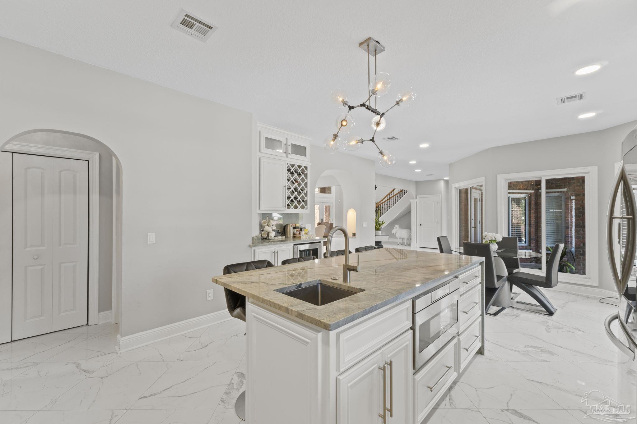 4818 Rosemont Place Pensacola, FL 32514 - Photo 24 of 69 a very nice looking dining room with a table and chairs