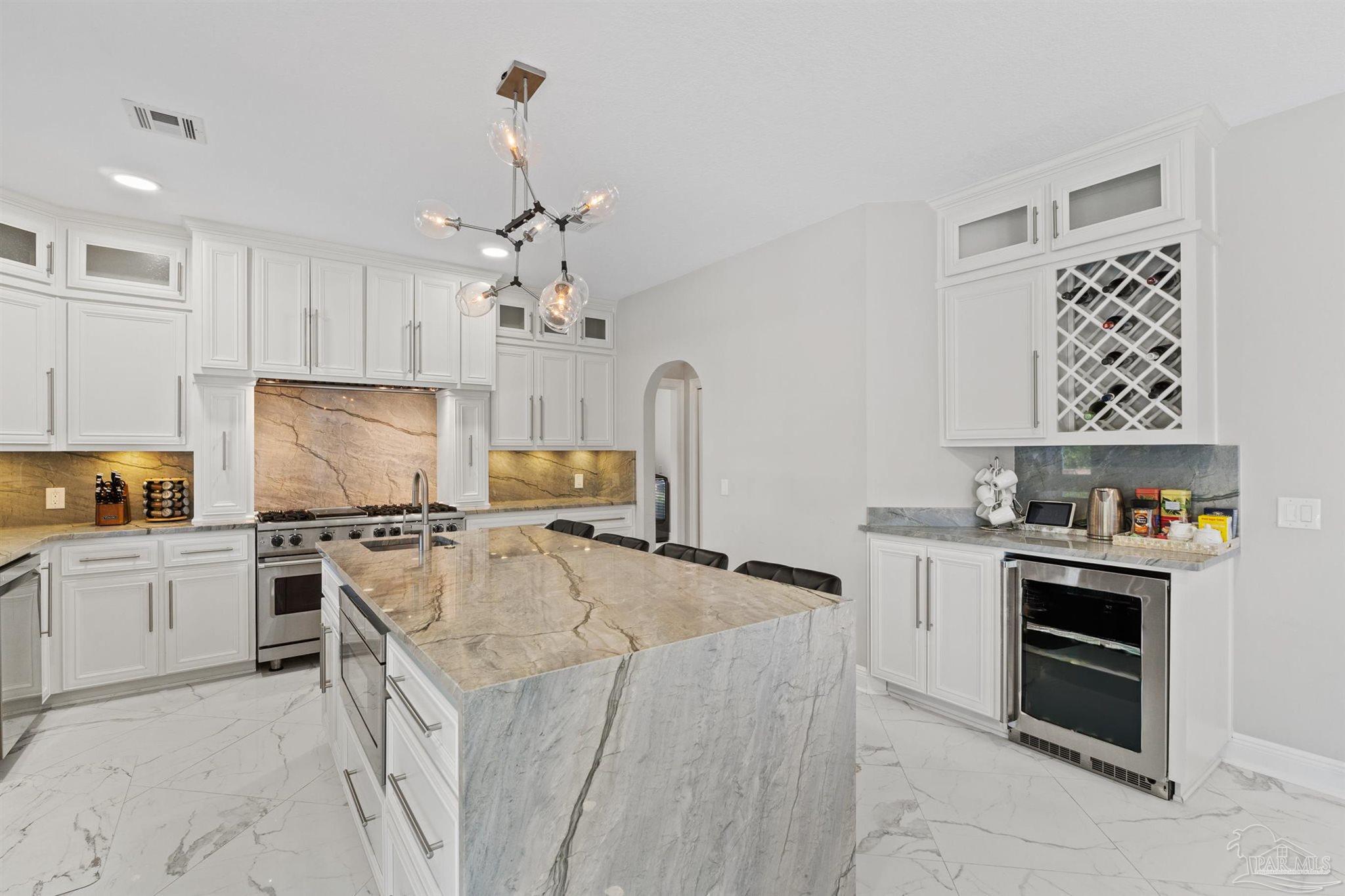 4818 Rosemont Place Pensacola, FL 32514 - Photo 25 of 69 a kitchen with granite countertop a sink stove and refrigerator