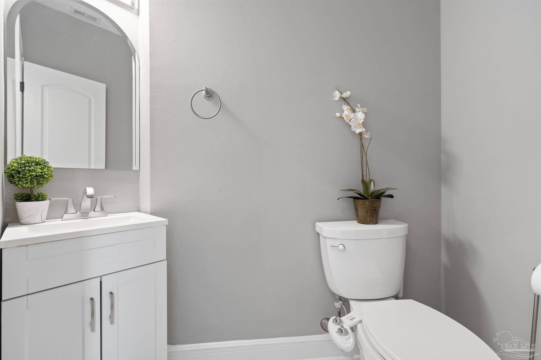 4818 Rosemont Place Pensacola, FL 32514 - Photo 26 of 69 a bathroom with a toilet a sink and mirror