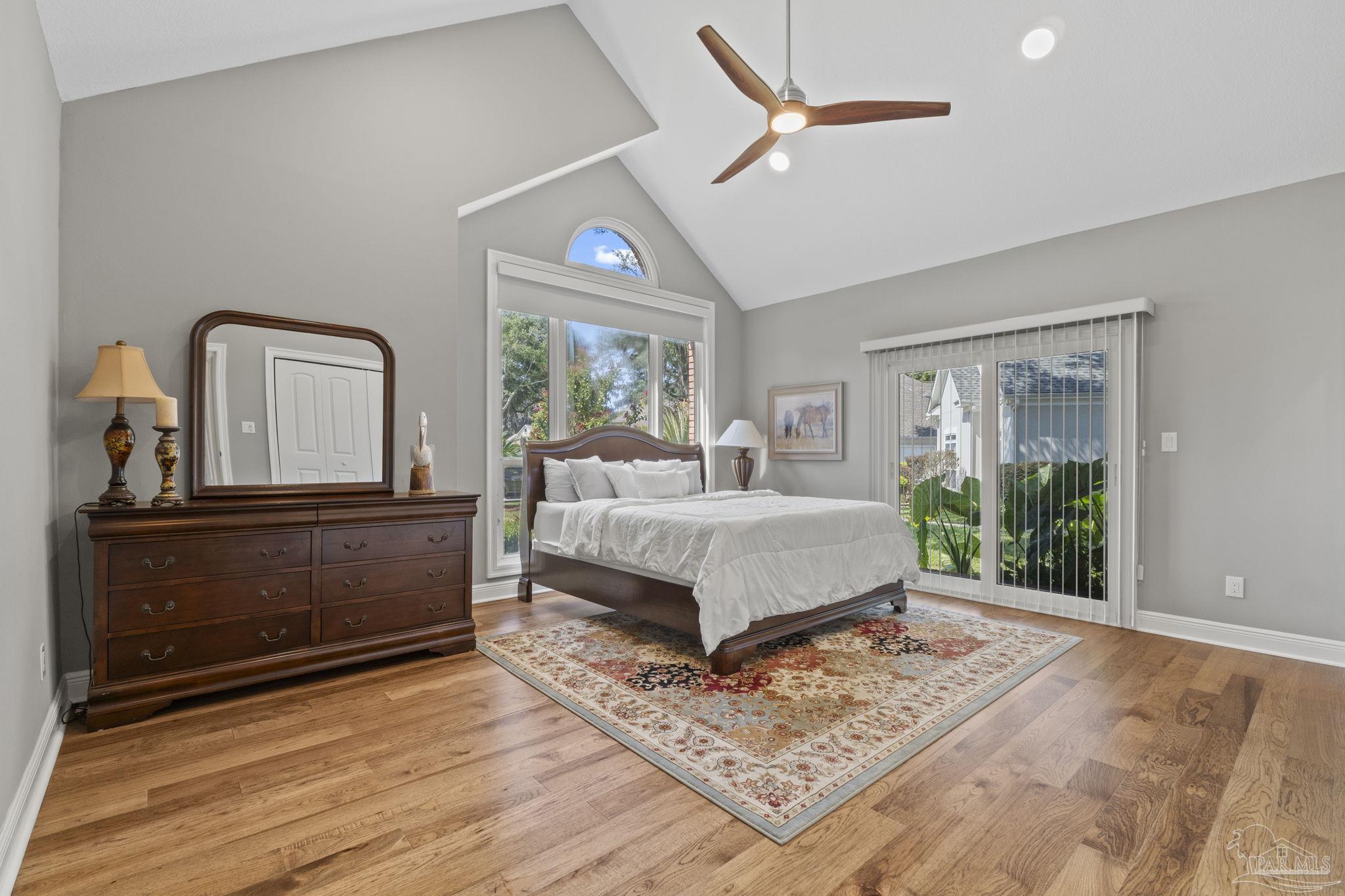 4818 Rosemont Place Pensacola, FL 32514 - Photo 28 of 69 a bedroom with a bed lamp closet and large window