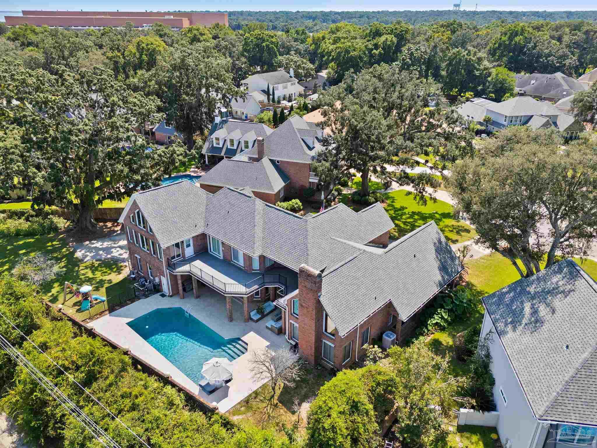 4818 Rosemont Place Pensacola, FL 32514 - Photo 3 of 69 an aerial view of a house with a swimming pool patio and outdoor seating