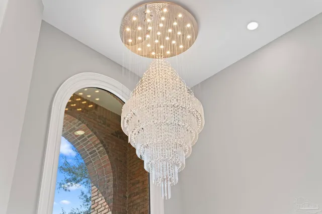 a view of a patio with a table and chairs under an umbrella