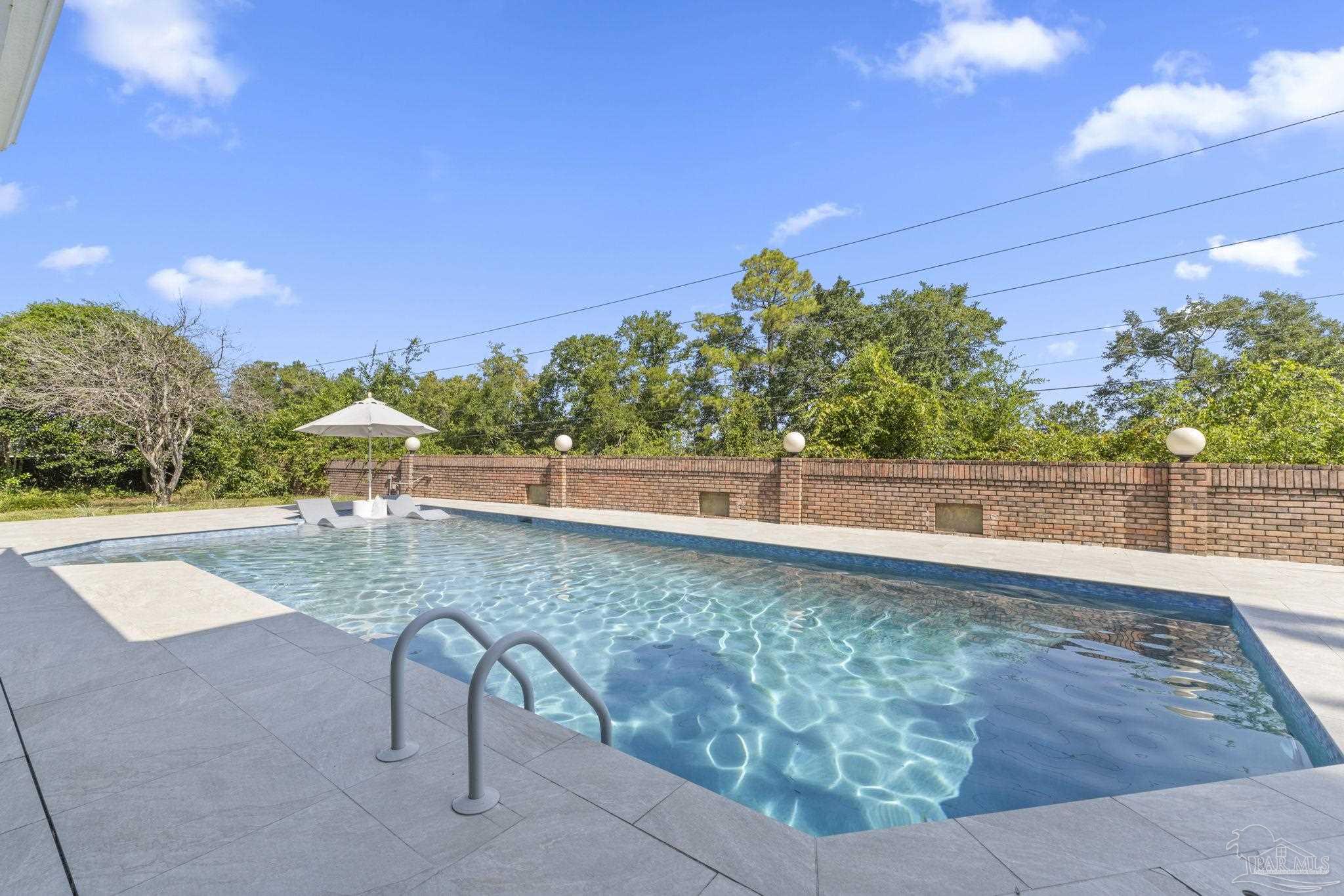 4818 Rosemont Place Pensacola, FL 32514 - Photo 4 of 69 a view of a swimming pool with a patio