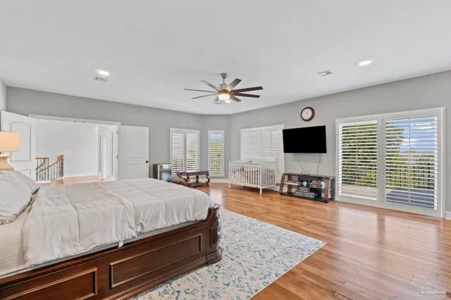 a view of an house with backyard and sitting area