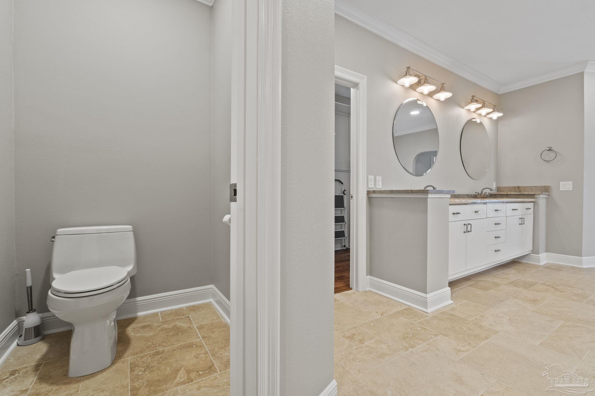 4818 Rosemont Place Pensacola, FL 32514 - Photo 47 of 69 a bathroom with a toilet sink and mirror