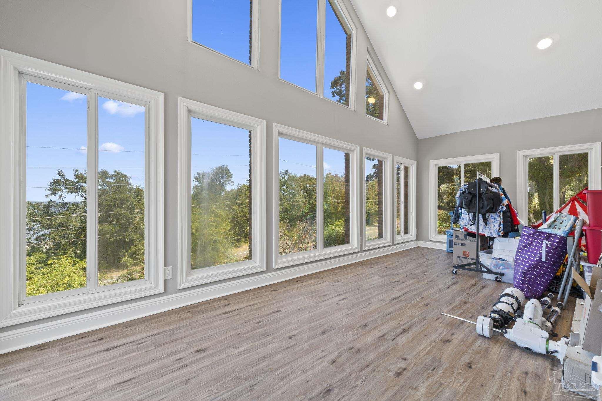 4818 Rosemont Place Pensacola, FL 32514 - Photo 48 of 69 a view of a room with gym equipment and floor to ceiling windows