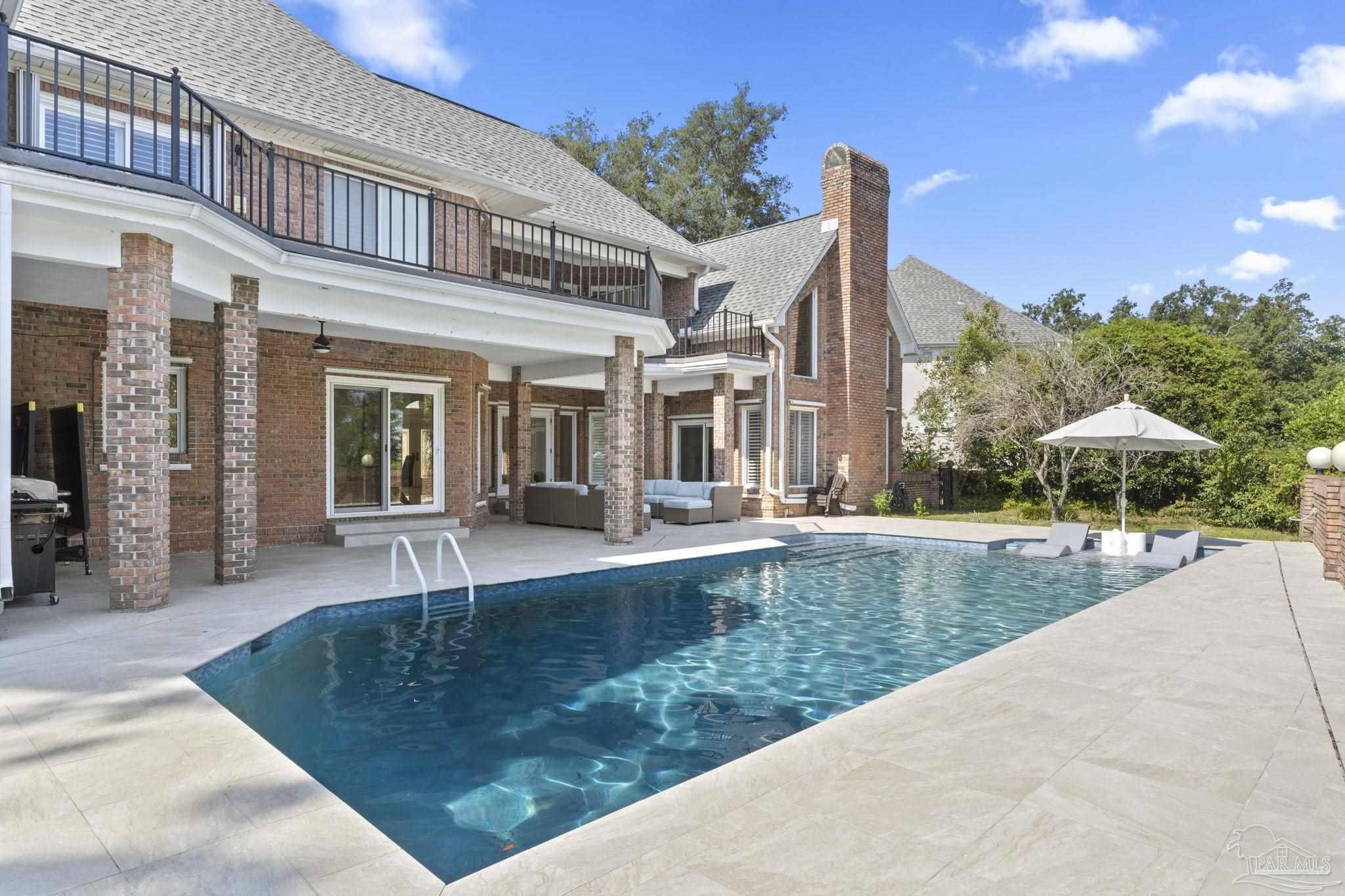 4818 Rosemont Place Pensacola, FL 32514 - Photo 5 of 69 a view of a house with swimming pool and sitting area