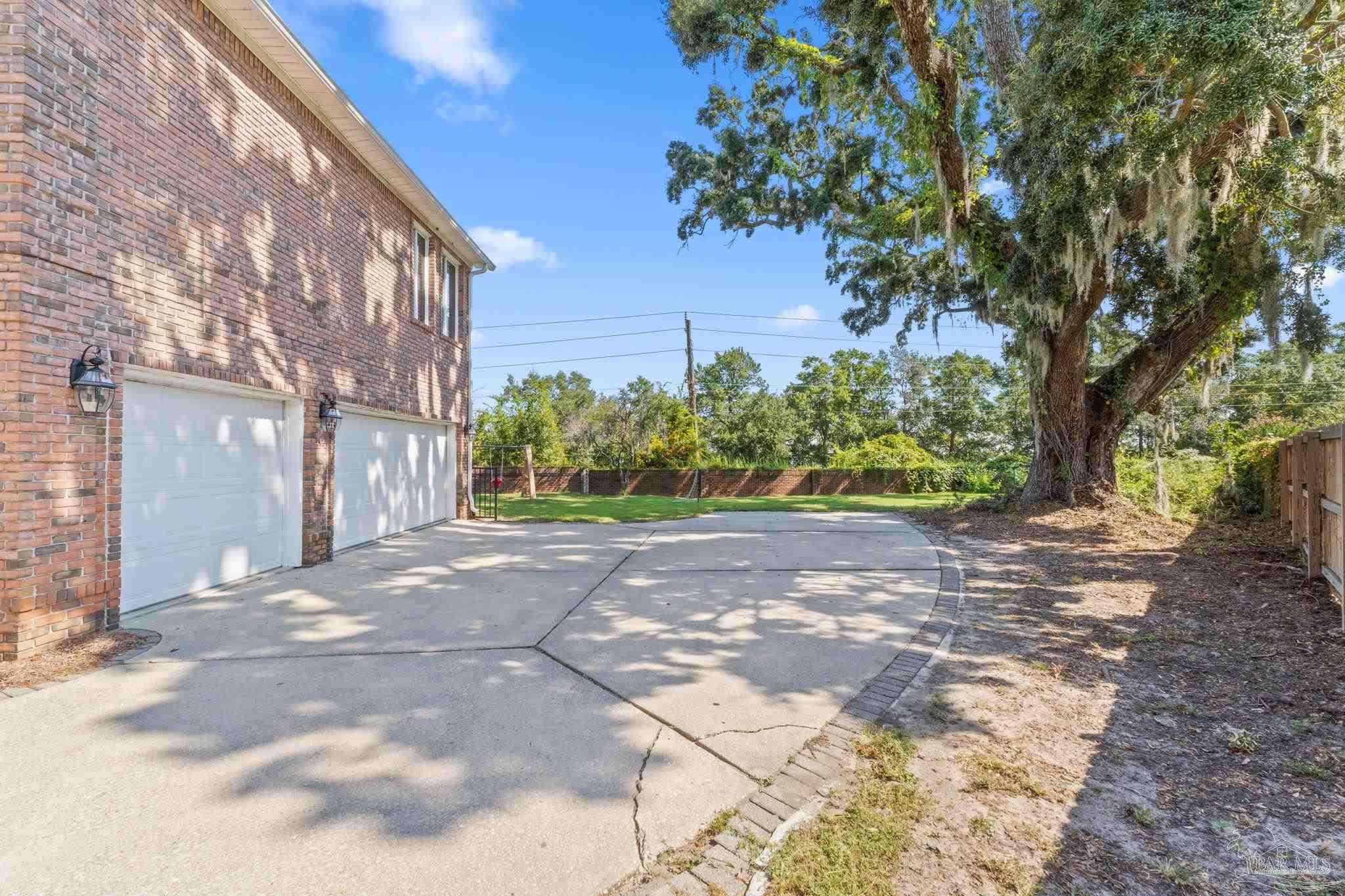 4818 Rosemont Place Pensacola, FL 32514 - Photo 56 of 69 a view of a street with a tree