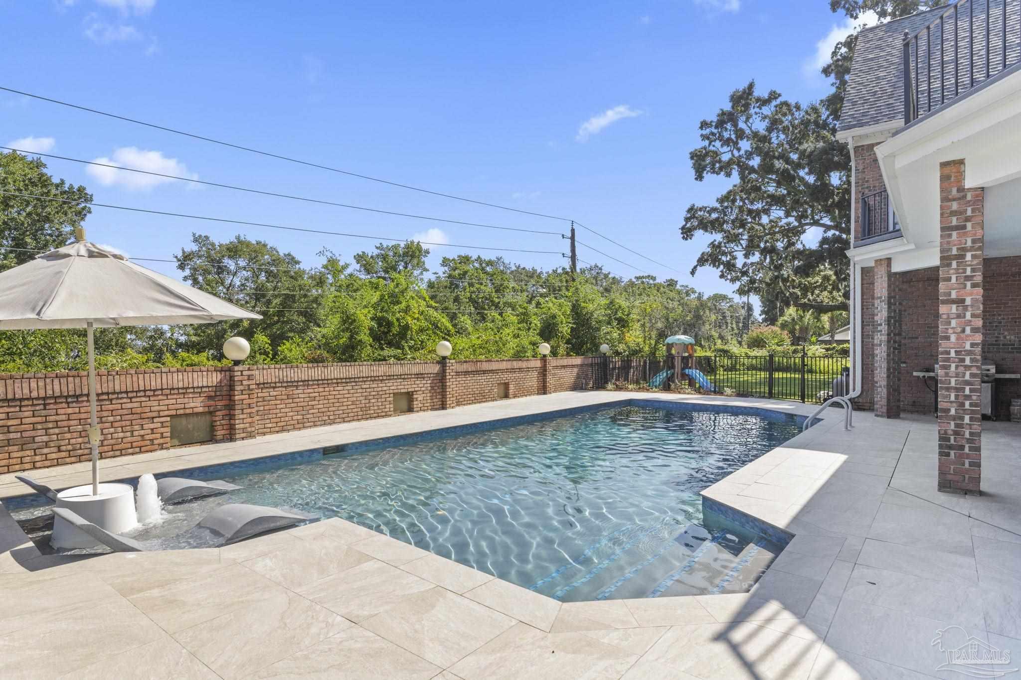 4818 Rosemont Place Pensacola, FL 32514 - Photo 58 of 69 a view of a swimming pool with a patio